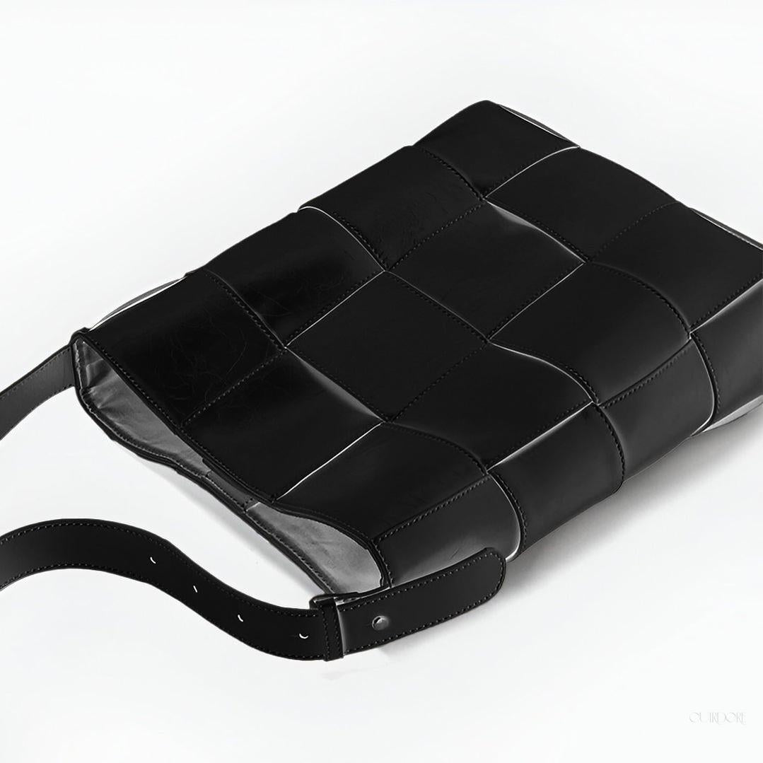 Black Glossy Woven Handbag — Modern structure with elevated shine