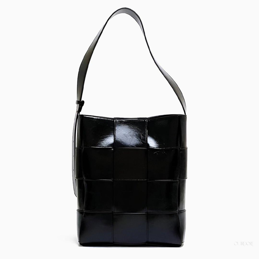 Black Glossy Woven Handbag — Modern structure with elevated shine